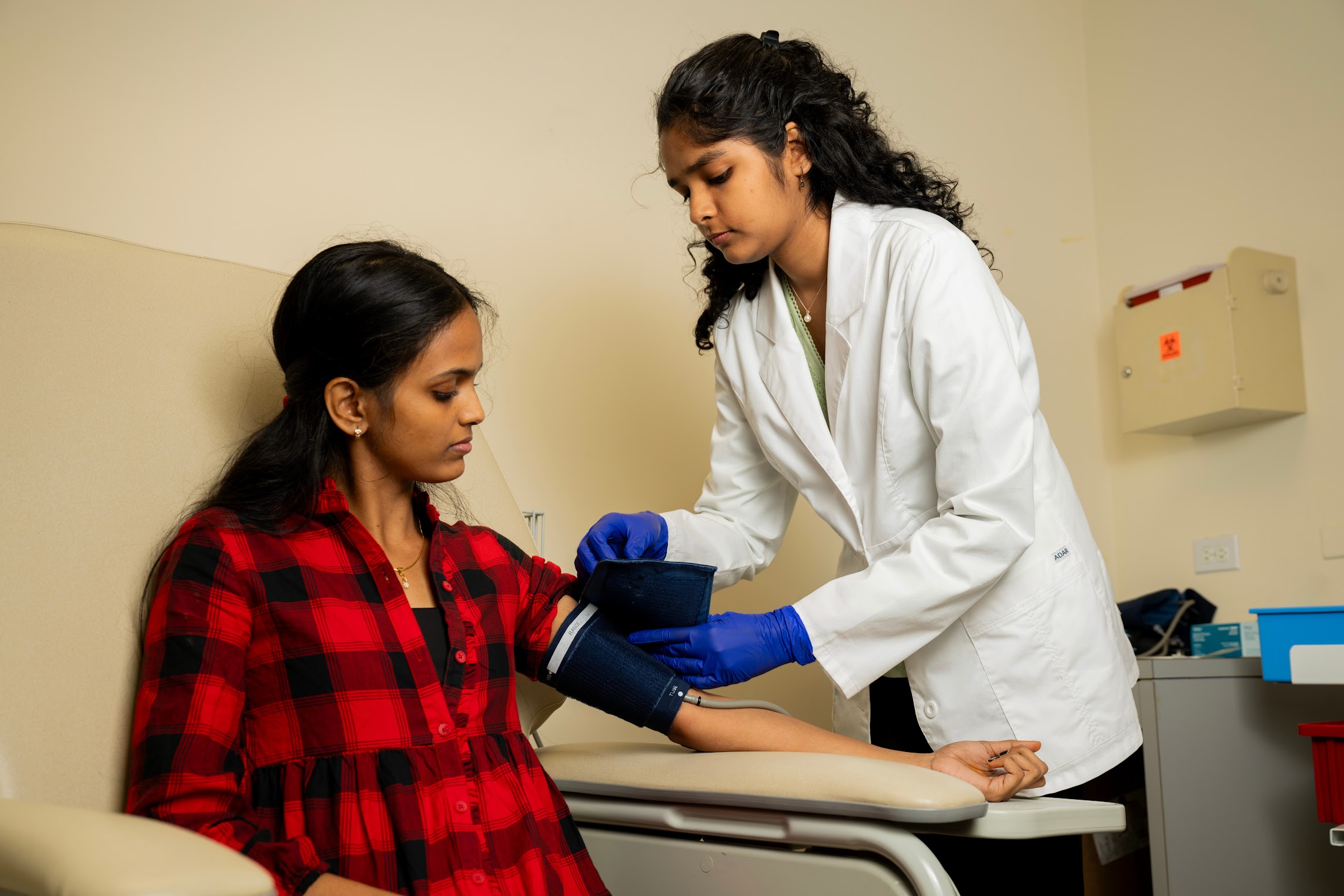 two pre-health students in a medical setting