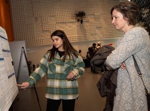 A students explains her applied mathematics research to faculty at the 2024 Menger Awards and Lecture
