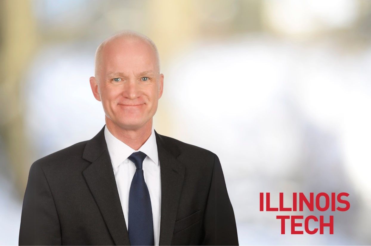 Rich Klein, wearing a suit and tie, smiles in front of a blurred background. Illinois Tech's logo is in the bottom right.