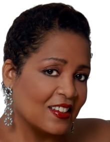 Headshot of Senabella Gill, host of the Wildflower Music Festival