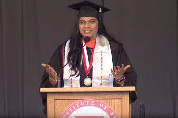 Photo of Shailee Shah speaking at commencement