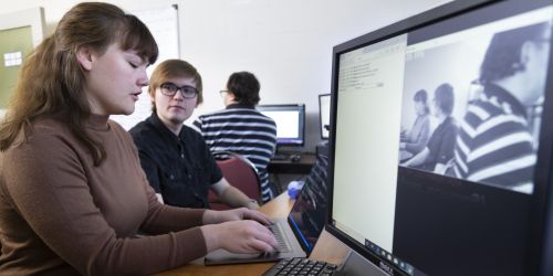 Students work on a mesh network research project in an ITM lab