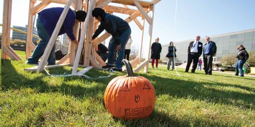 Pumpkin in front of trebuchet at the pumpkin launch