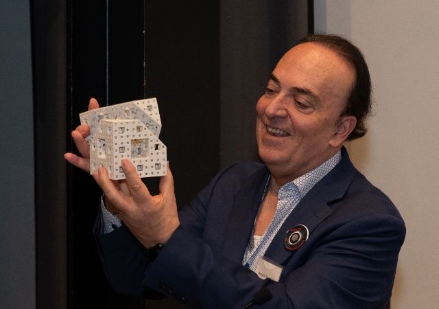 George Karniadakis, Charles Pitts Robinson and John Palmer Barstow Professor of Applied Mathematics at Brown University holds a model of the Menger sponge.
