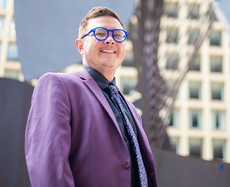 Illinois Tech alum August Hieber poses in downtown Chicago